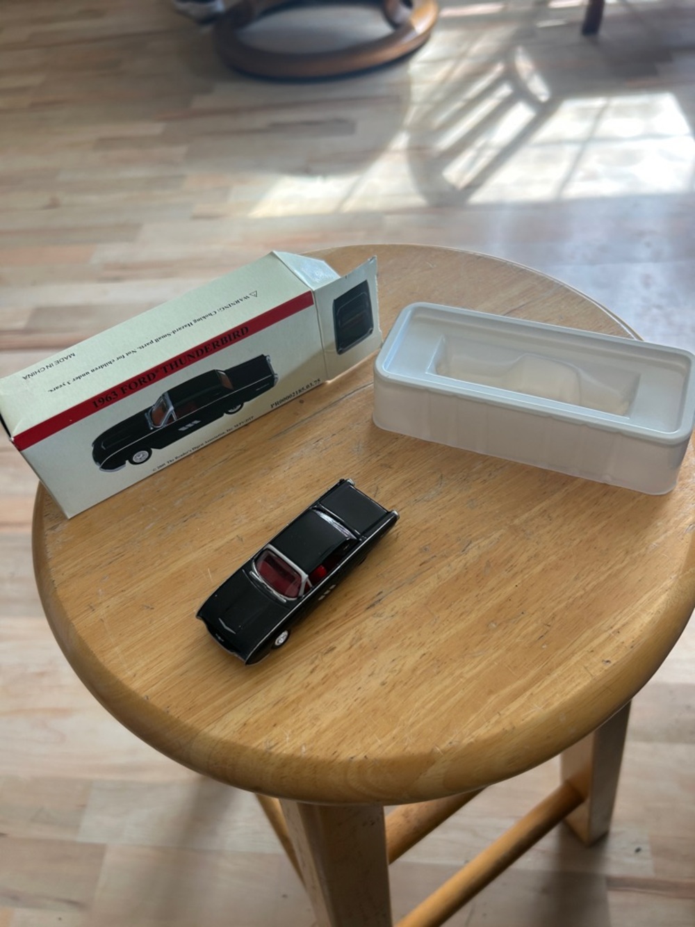 Black 1965 Ford Thunderbird Diecast Model with Box